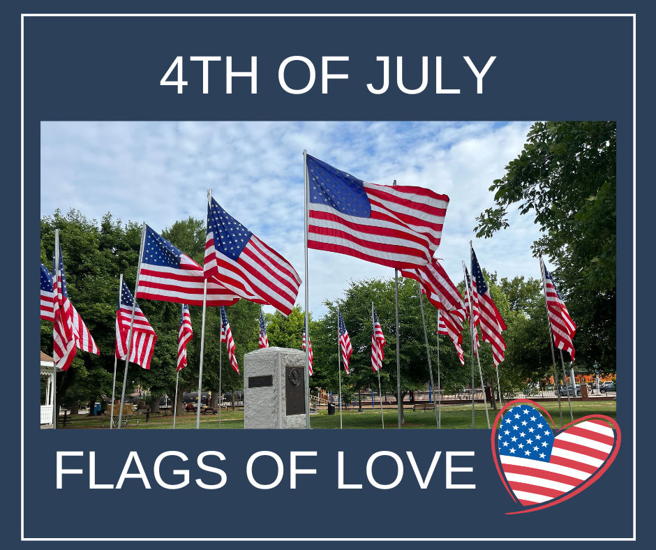 A display of American flags surrounds a monument in a park under a blue sky, with text reading 4th of July and Flags of Love. A heart-shaped USA flag graphic is at the bottom right.